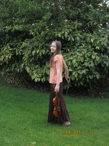 Hannah took my picture. There was a violin in the house, so we used it for the photo shoot!