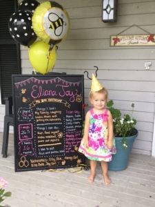 What a sweetheart! A friend made this chalkboard for Elly's party.