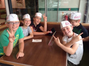 Here's Joel and some of his friends from church at Krispy Kreme - kids' club outing. 