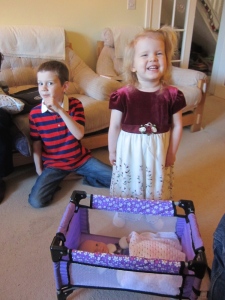 Here's Kaylah with her new doll bed that her sisters and Joel bought her.