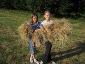 I call this the "Ruth and Naomi" photo . . . the girls gathered up loose grass from a field to feed to the Exmoor ponies that were behind the house where we stayed.