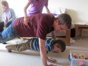 The Mead men doing press-ups! Watch out, Mariah is about to climb on top!